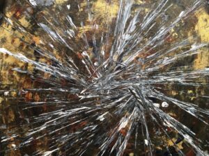 Silver Rays by Avyukt Ohri. Fine silver and white lines radiate from a single point against black and gold, like light racing outward, shattered glass or a star caught mid-explosion. High energy with strong contrast.